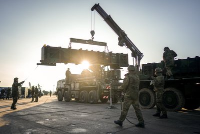 NATO soldiers unload missiles and components for the U.S. Patriot air defense system at Rzeszow Airport in Poland