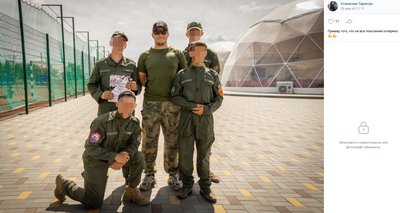In the photo, Taranchuk and teenagers are standing near a dome-shaped facility in the "Vanguard" camp In the photo, Taranchuk and teenagers are standing near a dome-shaped facility in the "Vanguard" camp