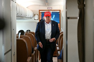 U.S. President Donald Trump attends a press briefing aboard Air Force One during a flight from Florida to Maryland, July 1, 2025