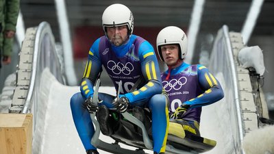 Ігор Гой (ліворуч) та Назарій Качмар (праворуч) на Олімпіаді-2026