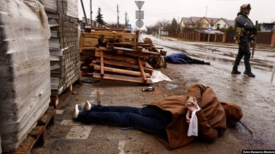 A killed civilian with tied hands on the street of Bucha nearby Kyiv. April 3, 2022