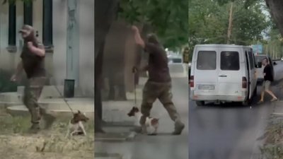 Чоловік у військовій формі тягне собаку до автівки